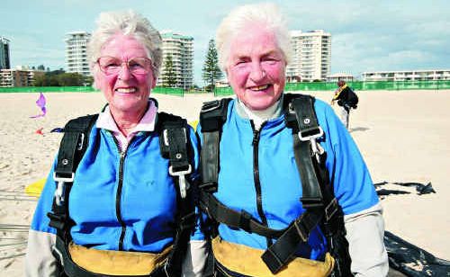 Sisters Leola Hull, 74, and Dulcie Anderson, 73, took the plunge over Kirra Beach on Monday. Sisters Leola Hull, 74, and Dulcie Anderson, 73, took the plunge over Kirra Beach on Monday.